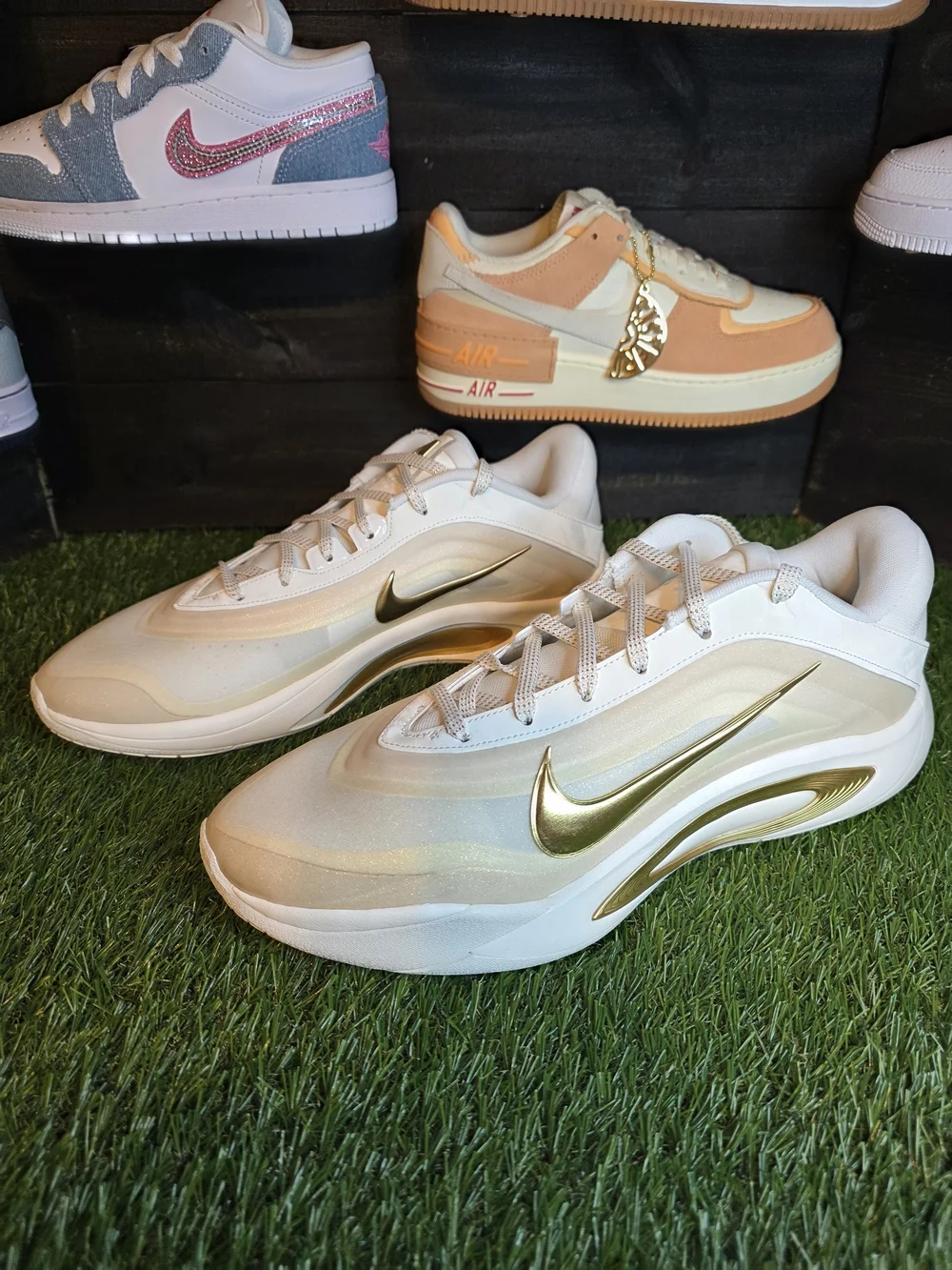 Nike Women's White Sneakers with Gold Swoosh